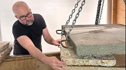 Professor putting a panel made of mushroom mycelium into test chamber