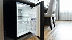 A mini frige in a dorm room