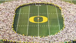 New students gathered in the shape of the O on football field 