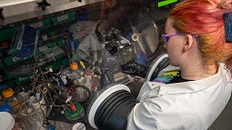 Lab student working in a pressurized glove box
