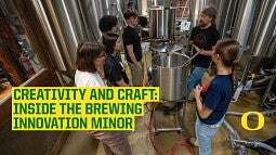 Students gathered around brewing equipment