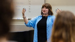 Student teacher in front of a high school music class