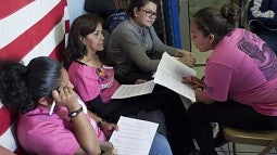 A group reading their stories