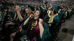 Cheering grads in Knight Arena