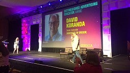 Dave Koranda walking across stage