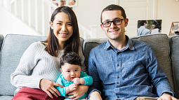 Family sitting on couch