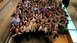 Mary Corrigan Solari (front row center) and recipients of her family's scholarships, which are part of the campaign's $1 billion total.