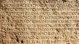 Image shows early Greek text on a tablet