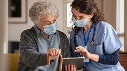 Doctor with older patient