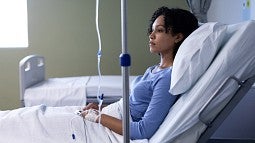 Black patient in hospital bed