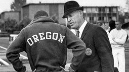 Bill Bowerman with track athlete