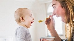 Mom feeding a baby