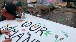 Woman making protest sign