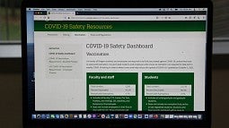 The COVID-19 dashboard on a laptop