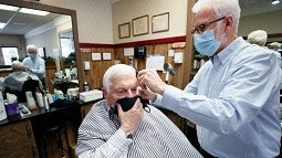 Barber cutting a man's hair