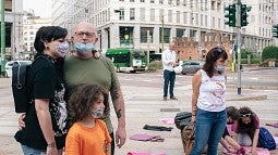 A family poses after the Not One Less protest