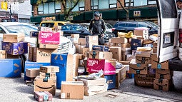 Delivery boxes stacked on sidewalk
