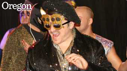 Mister Ooh-La-La performs in the gladiatorial glitz that is professional wrestling as a lint brush-wielding sideman who is often drawn into the fray. Photograph courtesy Mister Ooh-La-La
