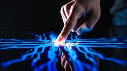 Finger touching flat screen