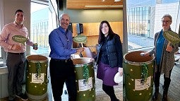 People donating food in barrels