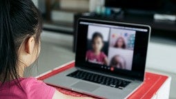 Girl during Zoom session on laptop