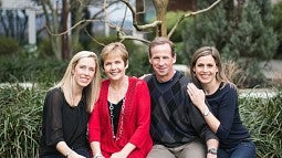 Claudia Lacey McNeil (in red) with her husband Dan and daughters, Christy MacColl and Carrie Gross. A scholarship fund is being established in McNeil's name by her friend, Gretchen Anderson Pilip.