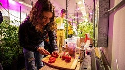 Students Rachael Maloney and Zachary Colligan in the Grow Pod.