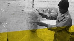 A Black artist working on a sculpture