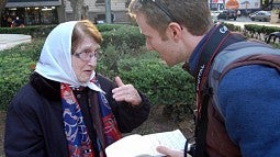 SOJC student Christian Hartwell interviewing a protester in Argentina.