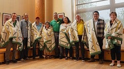 Tribal representatives with Home Flight blankets