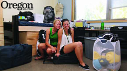 Mother and daughter Sharon (Bell) Burns '63 and Haley Burns pose amid the belongings they've brought to make Haley's new room functional and cozy. Photograph by Jack Liu