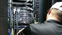 Worker installing computer system