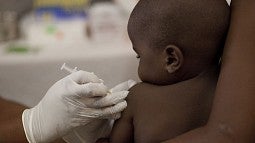 An infant receiving an injection