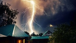 Lightning striking near homes