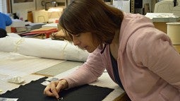 Anthropological collections manager Elizabeth Kallenbach examines ancient shell beads found at Fort Rock Basin