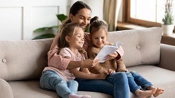 Nanny reading to children