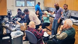 Clockwise from bottom right: George Carroll (UO), Jack Rogers (WSU), Bitty Roy (UO), Yu-Ming Ju (Academia Sinica, at microscope), Ron Hamill, Danny Newman, Josh Kielsmeier-Cook (Ph.D student at University of Minnesota, standing), Susie Holmes (Lane Commun