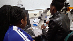 High school student with UO mentor in lab