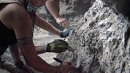 A team works inside one of the Paisley Caves in summer 2009