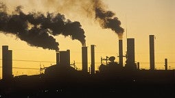 Silhouette of smokestacks