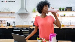 Woman drinking protein shake