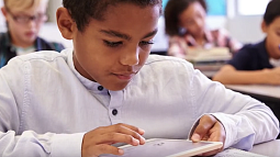 Child reading from a tablet