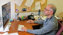 Reza Rejaie at his desk