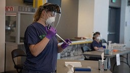 Lab technician processing saliva sample