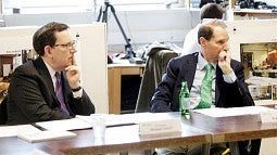 UO President Michael Schill (left) and U.S. Sen. Ron Wyden listen as speakers discuss a joint program to boost wood manufacturing in Oregon.