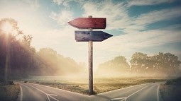 Image of a fork in a highway with directional signs