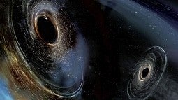 Image shows two spinning black holes with properties like those found in the merger detected in January