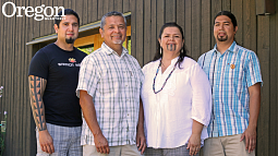 Guylish Bommelyn, Loren Bommelyn, Marva Jones, and Pyuwa Bommelyn outside the UO's Many Nations Longhouse during the Northwest Indian Languages Summer Institute. Photograph by Jack Liu