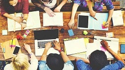 People working around a table seen from above