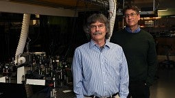 Michael Raymer (left) and Andy Marcus in their lab.